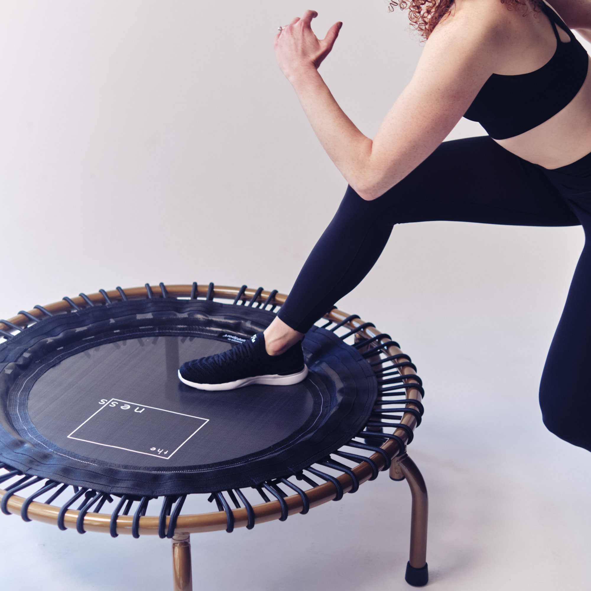 Jumping on a trampoline for online exercise